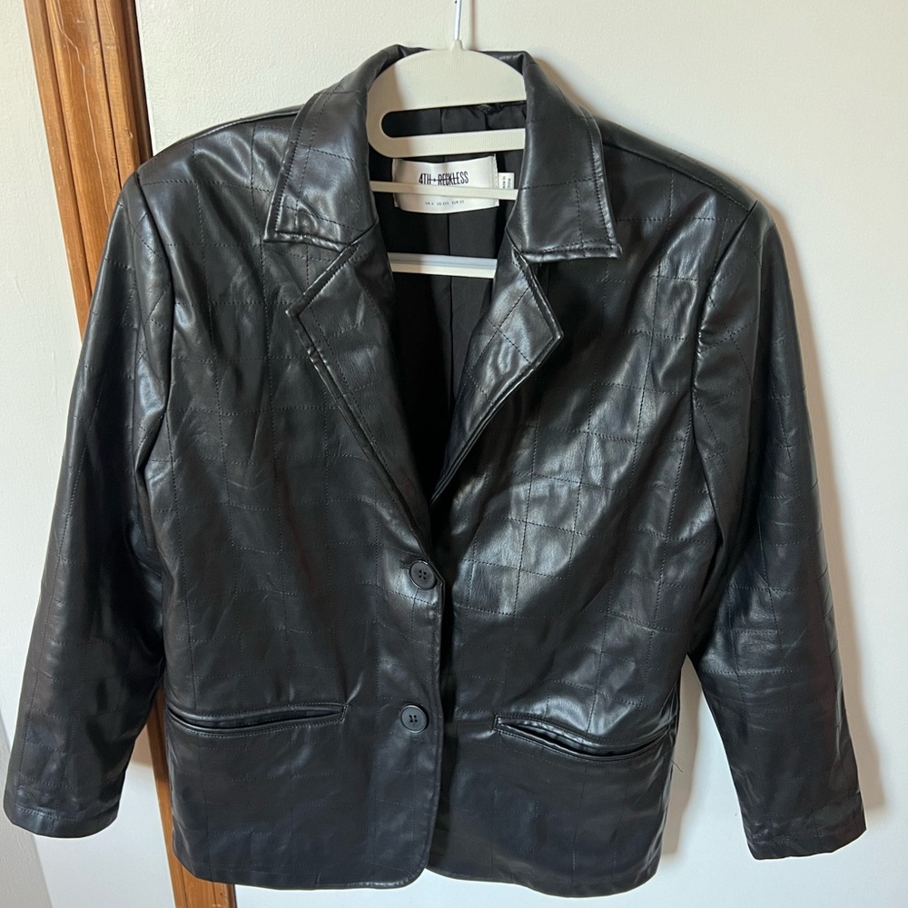 Oversized black leather jacket.